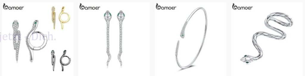 Krafttier Schlange: Schmuck-Set mit Schlangenmotiven, darunter Ringe, Ohrringe und Armreif. Gefährliche Weisheit durch Schmuck dargestellt.